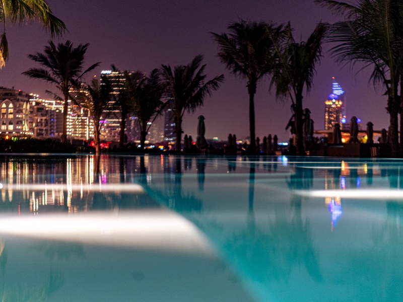 Float the evening away with The Club’s unique night swim experience this summer